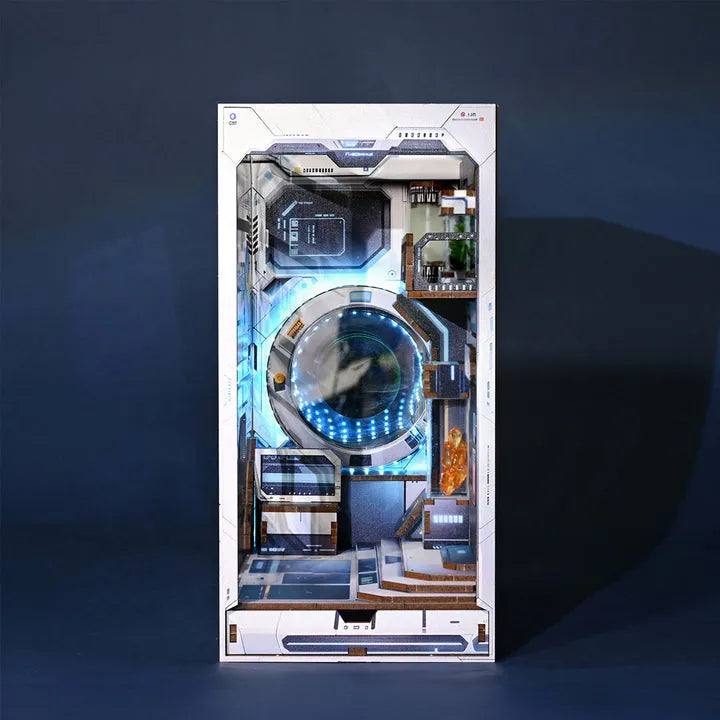 Book Nook - Alien Hub, un kit créatif pour construire un diorama miniature. Parfait pour décorer une bibliothèque ou comme cadeau original pour un amoureux des livres. Par Nookette.