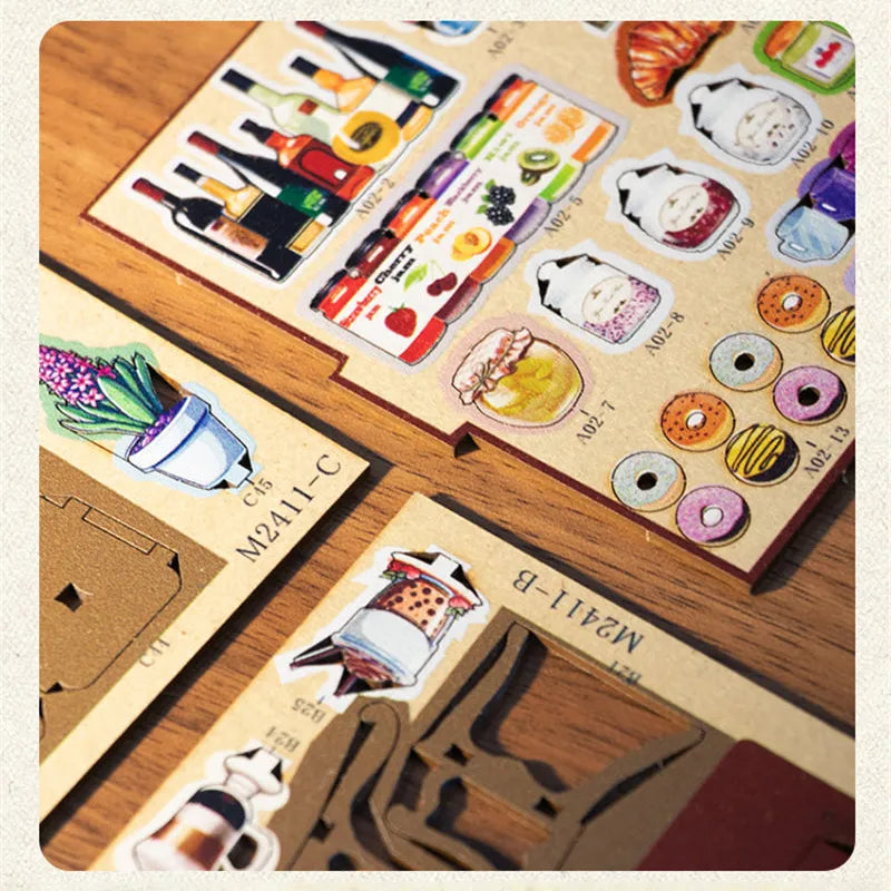 Book Nook - Coffee House, un kit créatif pour construire un diorama miniature. Parfait pour décorer une bibliothèque ou comme cadeau original pour un amoureux des livres. Par Nookette.