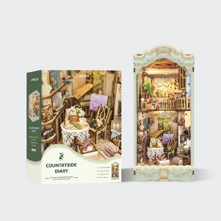 Book Nook - Countryside Diary, un kit créatif pour construire un diorama miniature. Parfait pour décorer une bibliothèque ou comme cadeau original pour un amoureux des livres. Par Nookette.