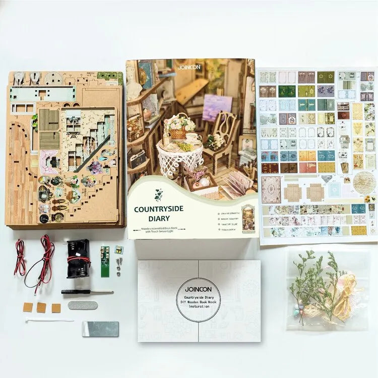 Book Nook - Countryside Diary, un kit créatif pour construire un diorama miniature. Parfait pour décorer une bibliothèque ou comme cadeau original pour un amoureux des livres. Par Nookette.
