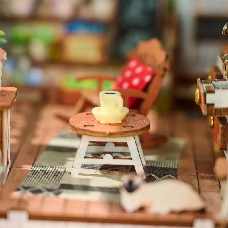 Book Nook - Happy Moments, un kit créatif pour construire un diorama miniature. Parfait pour décorer une bibliothèque ou comme cadeau original pour un amoureux des livres. Par Nookette.