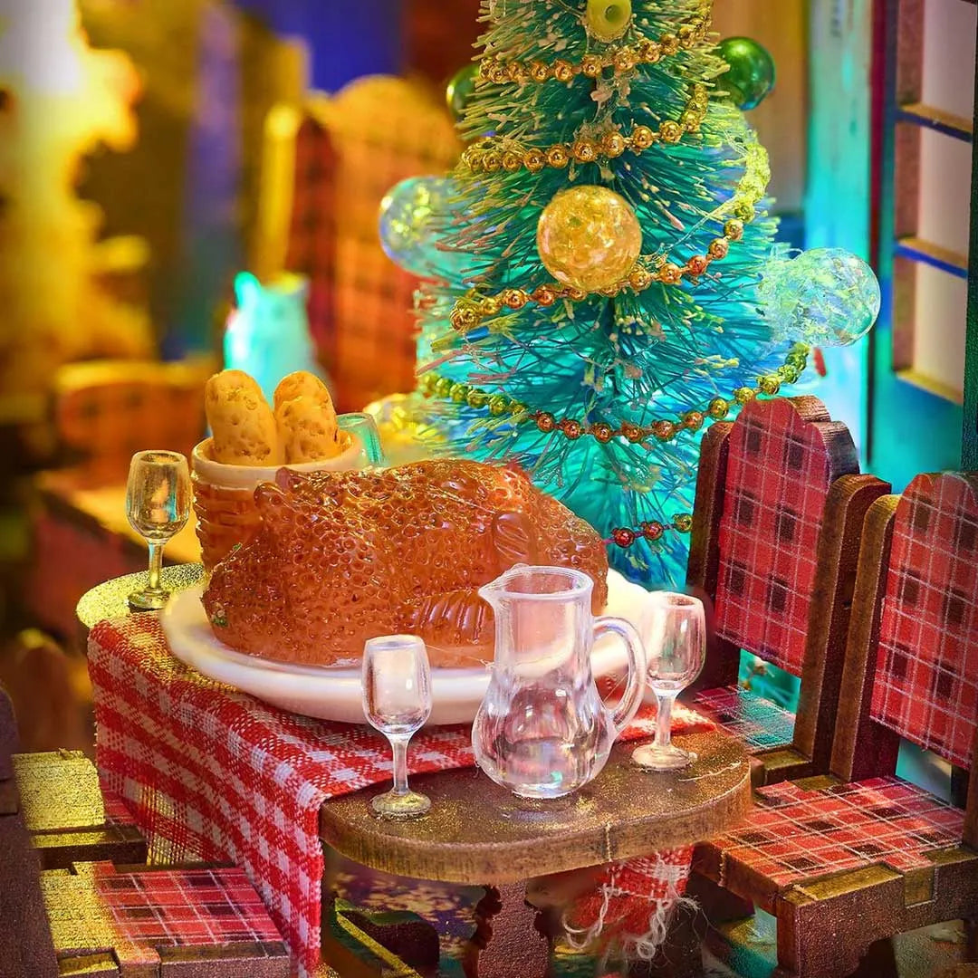Book Nook - Merry Christmas, un kit créatif pour construire un diorama miniature. Parfait pour décorer une bibliothèque ou comme cadeau original pour un amoureux des livres. Par Nookette.