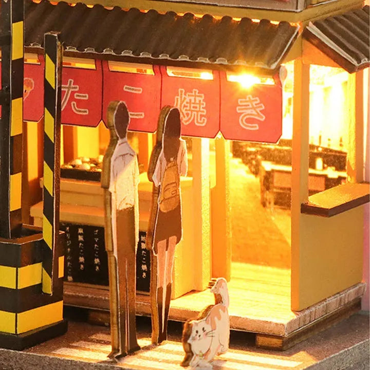 Book Nook - Sakura Holiday, un kit créatif pour construire un diorama miniature. Parfait pour décorer une bibliothèque ou comme cadeau original pour un amoureux des livres. Par Nookette.