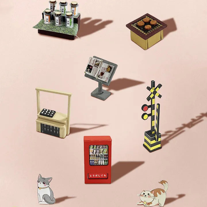 Book Nook - Sakura Holiday, un kit créatif pour construire un diorama miniature. Parfait pour décorer une bibliothèque ou comme cadeau original pour un amoureux des livres. Par Nookette.