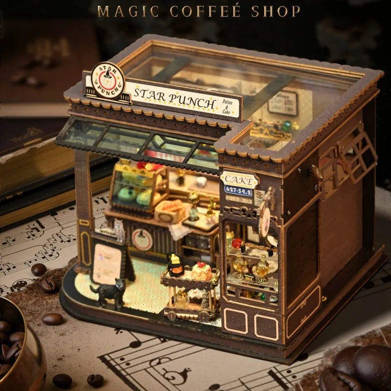 Maison Miniature - Magic Coffee Shop, un kit créatif pour construire un diorama miniature. Parfait pour décorer une bibliothèque ou comme cadeau original pour un amoureux des livres. Par Nookette.