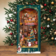 Book Nook - Christmas Jingle Cabin, un kit créatif pour construire un diorama miniature. Parfait pour décorer une bibliothèque ou comme cadeau original pour un amoureux des livres. Par Nookette.