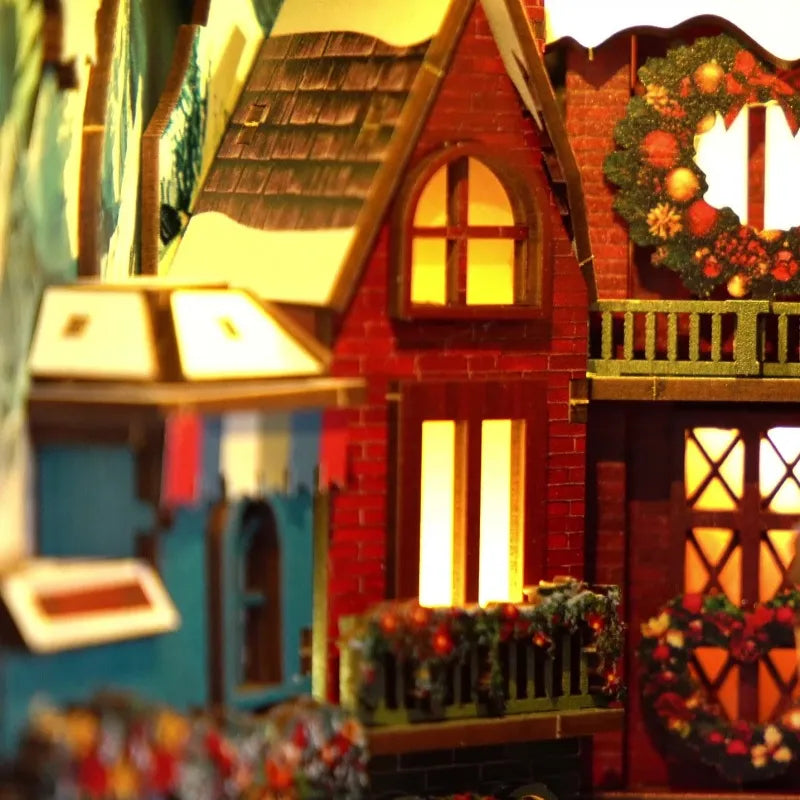 Book Nook - Christmas Street Corner, un kit créatif pour construire un diorama miniature. Parfait pour décorer une bibliothèque ou comme cadeau original pour un amoureux des livres. Par Nookette.