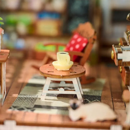 Book Nook - Happy Moments, un kit créatif pour construire un diorama miniature. Parfait pour décorer une bibliothèque ou comme cadeau original pour un amoureux des livres. Par Nookette.