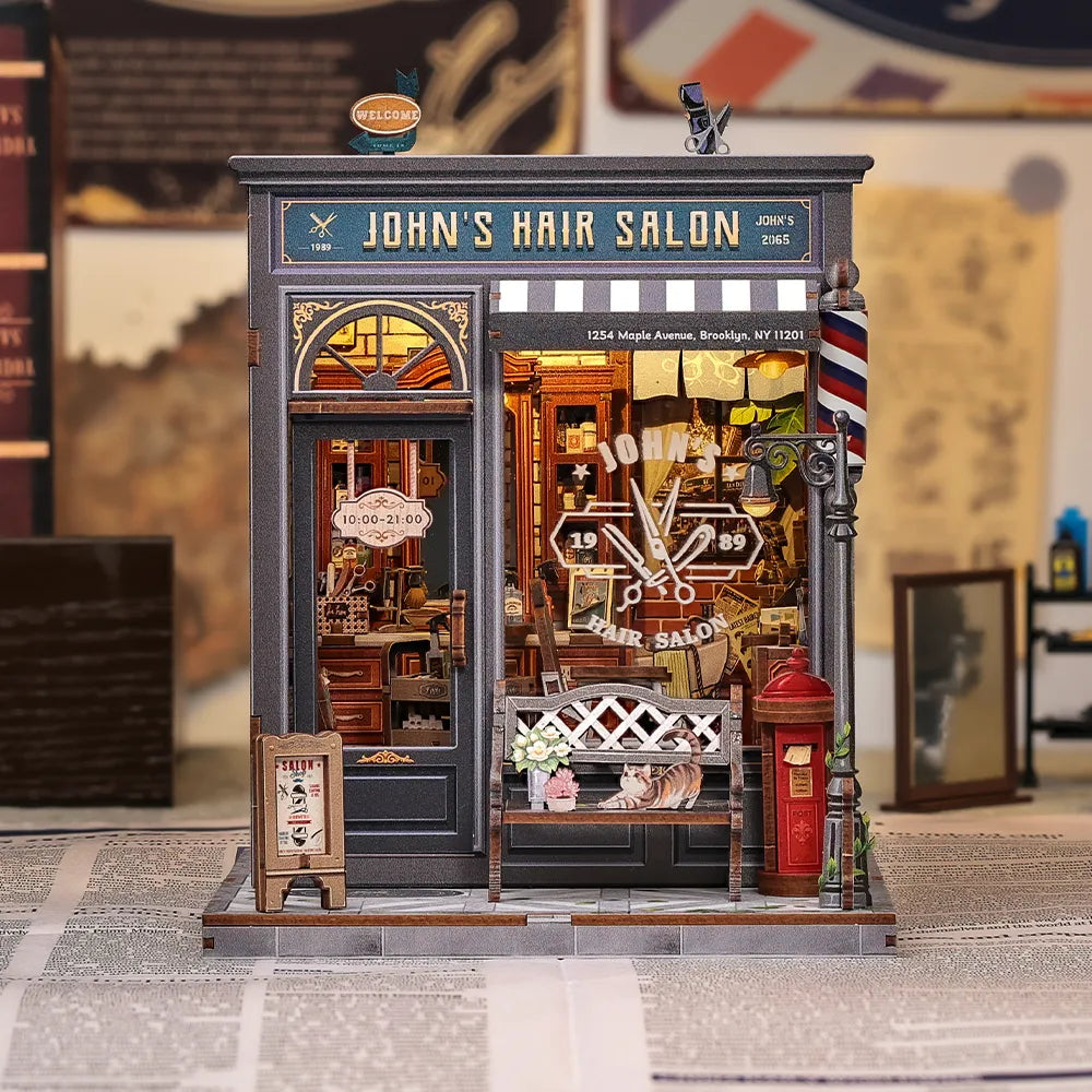 Book Nook - John's Hair Salon, un kit créatif pour construire un diorama miniature. Parfait pour décorer une bibliothèque ou comme cadeau original pour un amoureux des livres. Par Nookette.