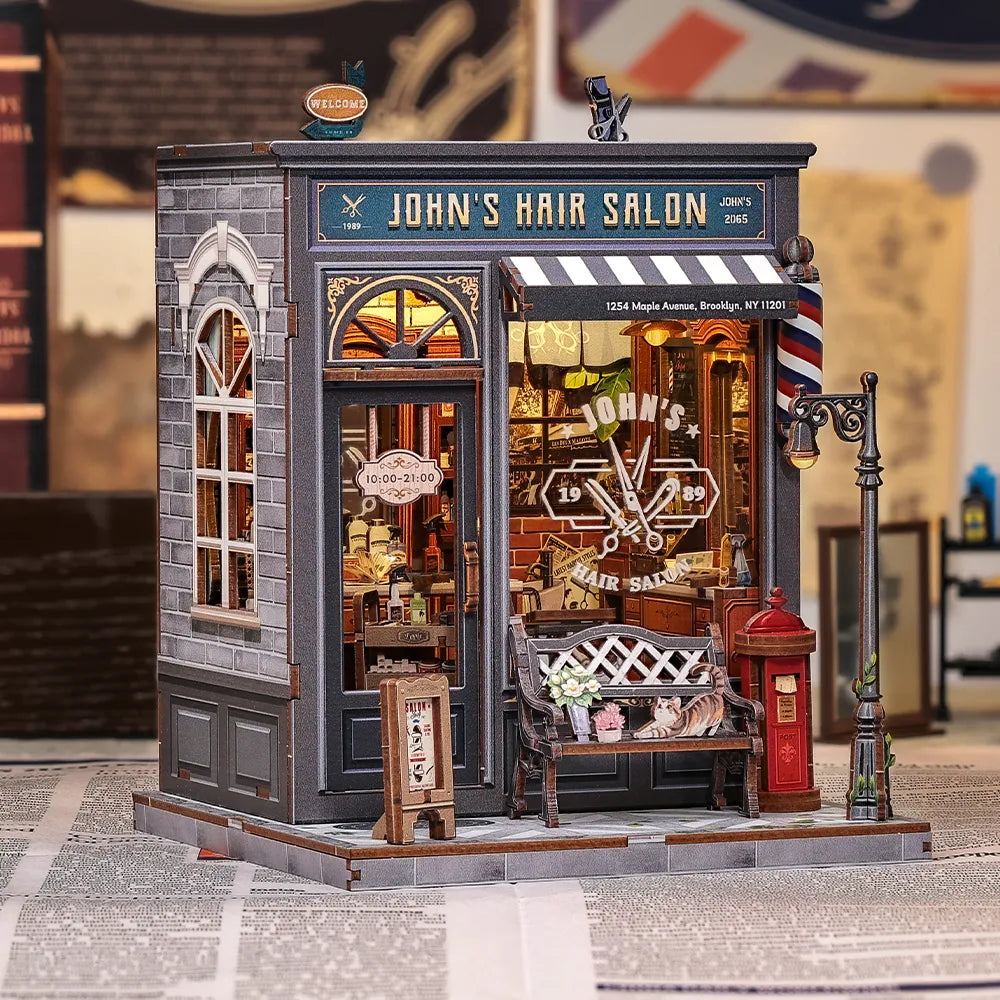 Book Nook - John's Hair Salon, un kit créatif pour construire un diorama miniature. Parfait pour décorer une bibliothèque ou comme cadeau original pour un amoureux des livres. Par Nookette.