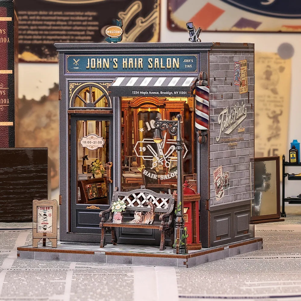 Book Nook - John's Hair Salon, un kit créatif pour construire un diorama miniature. Parfait pour décorer une bibliothèque ou comme cadeau original pour un amoureux des livres. Par Nookette.