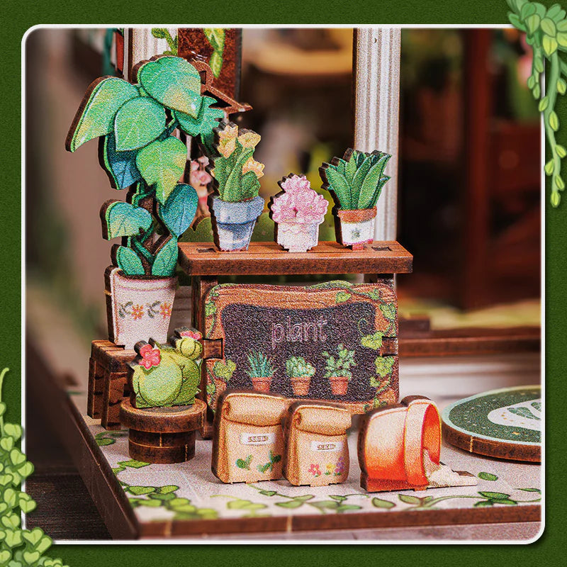 Book Nook - Green Life Bookshop, un kit créatif pour construire un diorama miniature. Parfait pour décorer une bibliothèque ou comme cadeau original pour un amoureux des livres. Par Nookette.