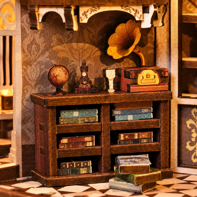 Sous le gramophone décoratif, une petite bibliothèque rassemble ses volumes. Globe et pendule complètent cette collection d’objets qui semblent attendre leur prochaine histoire.