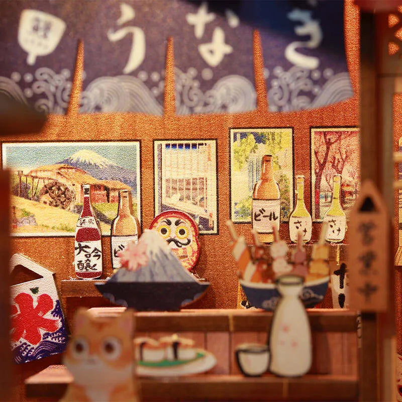 Book Nook - Under The Sakura Tree, un kit créatif pour construire un diorama miniature. Parfait pour décorer une bibliothèque ou comme cadeau original pour un amoureux des livres. Par Nookette.