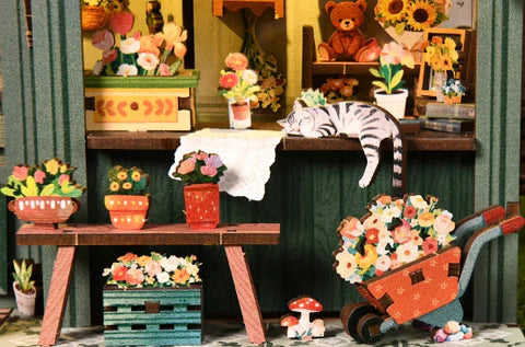 Brouette fleurie et chat paresseux