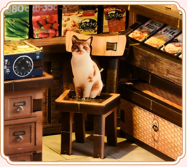 Le chat orange sur le tabouret
