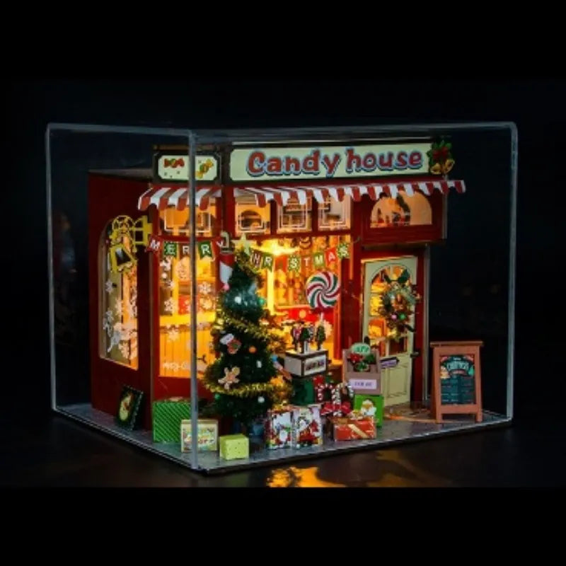 Maison Miniature - Candy House, un kit créatif pour construire un diorama miniature. Parfait pour décorer une bibliothèque ou comme cadeau original pour un amoureux des livres. Par Nookette.