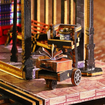 Maison Miniature - Rail Track Secluded City, un kit créatif pour construire un diorama miniature. Parfait pour décorer une bibliothèque ou comme cadeau original pour un amoureux des livres. Par Nookette.